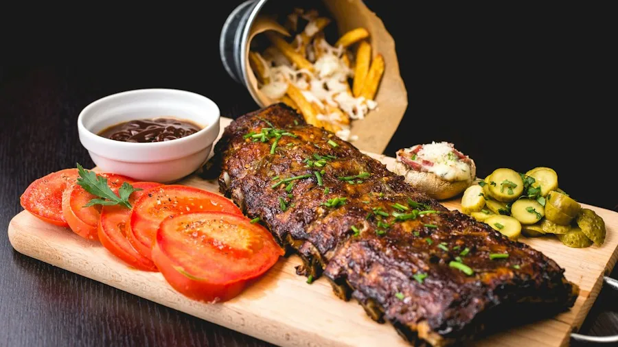 Corky's Frozen Baby Back Ribs Arrive: What Oven-Baking Shoppers Should Know 3 barbecue ribs plated with sides