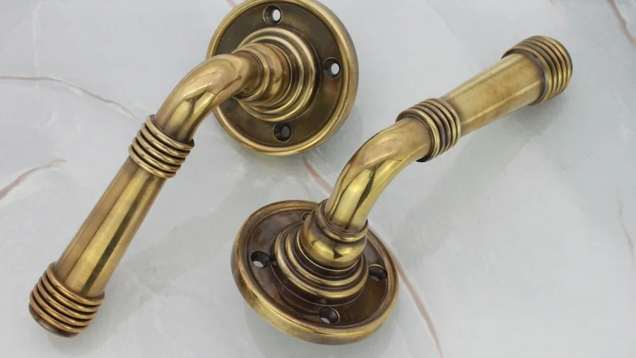 Expert-Approved Bathroom Fixture Brands Help Shoppers Choose the Right Faucets and Finishes 3 brass bathroom hardware patina
