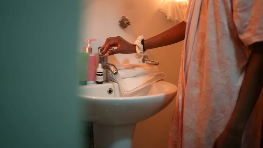 child brushing teeth in bathroom sink