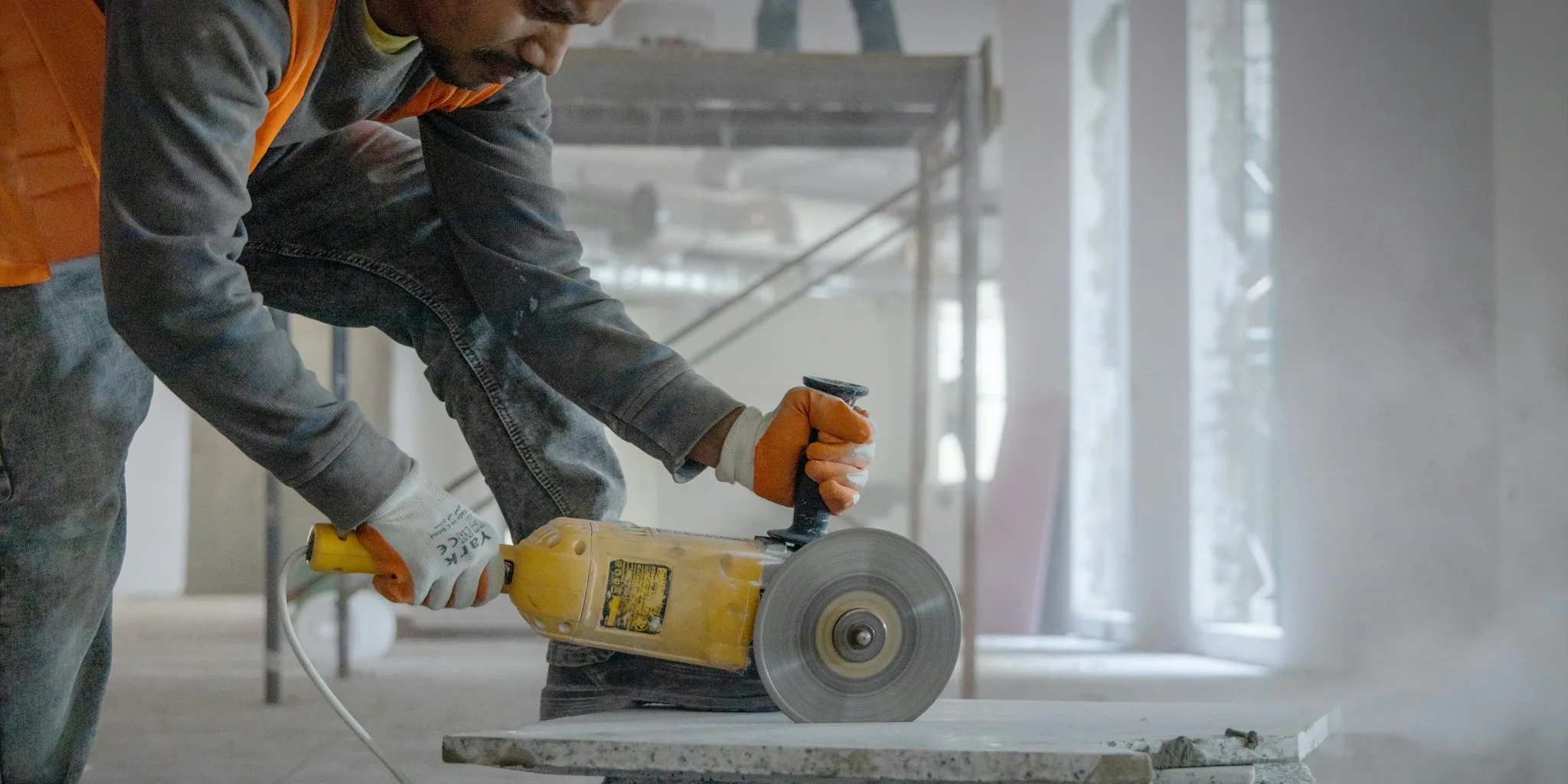 construction worker using portable speaker jobsite