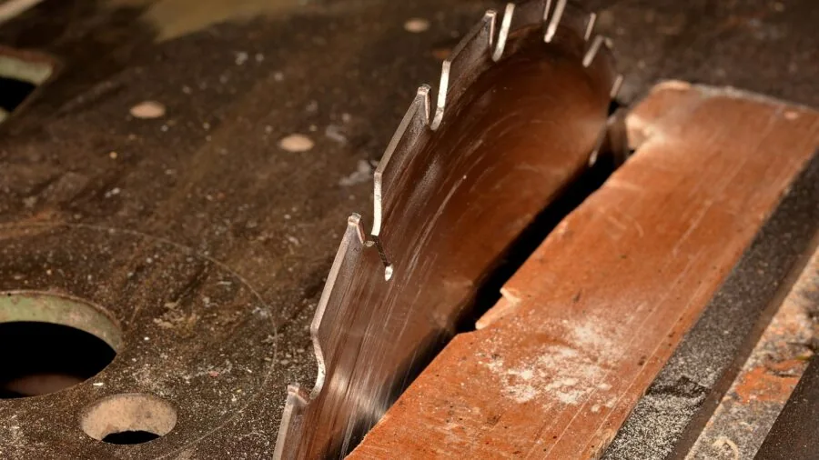 DIY Wood Towel Rack Replaces Builder Grade Fixtures in Your Bathroom 2 cutting wood with power jig saw
