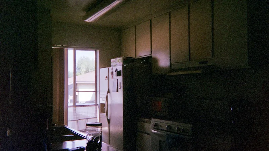 Kitchen Paint Makeover Transforms Dark Space into Bright Neutral Haven 2 dark brown kitchen cabinets before renovation