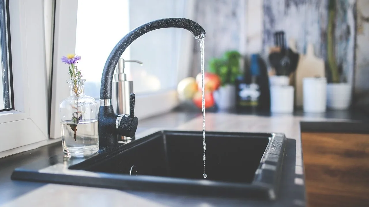 Dark Kitchen Cabinets Surprisingly Make Small Spaces Feel Bigger