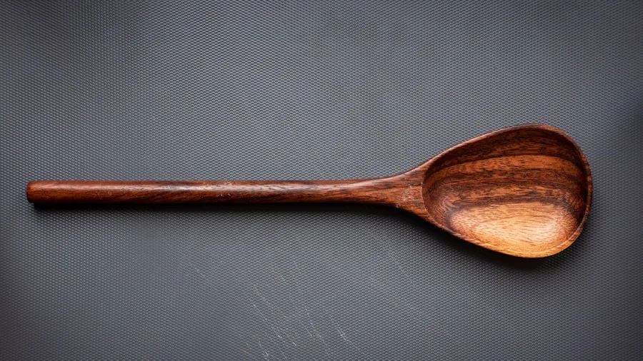 Wooden Kitchen Tools: How Proper Care Extends Their Lifespan for Home Cooks 2 hand washing wooden spoon