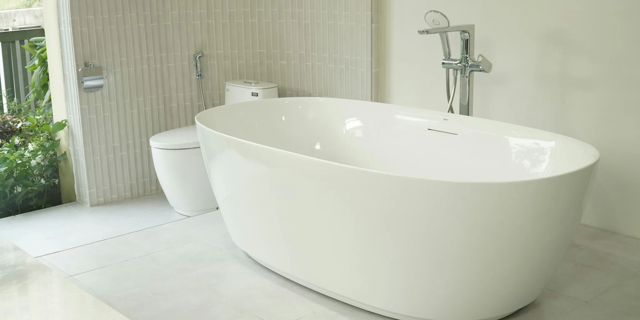 Budget Bathroom Upgrade: How to Refinish a Bathtub and Add Stone Tiles in One Weekend