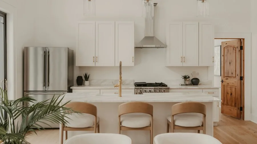 neutral kitchen with brass hardware and light wood