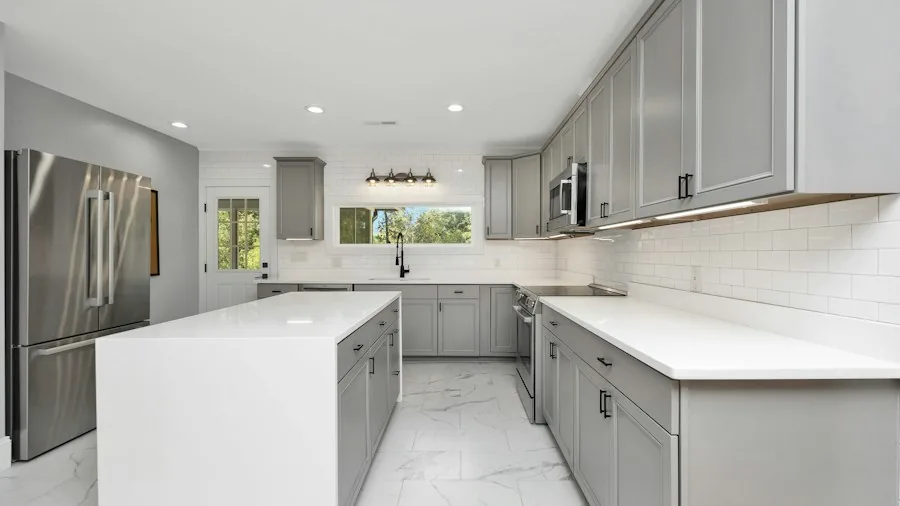 Kitchen Cabinet Paint Transformation Saves Thousands for Dated 90s Homes 3 two tone painted kitchen cabinets