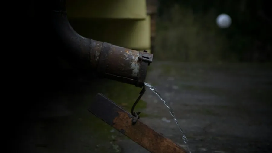 7 Tips to Maintain Your Roof and Gutters Year Round 3 water overflowing gutter downspout