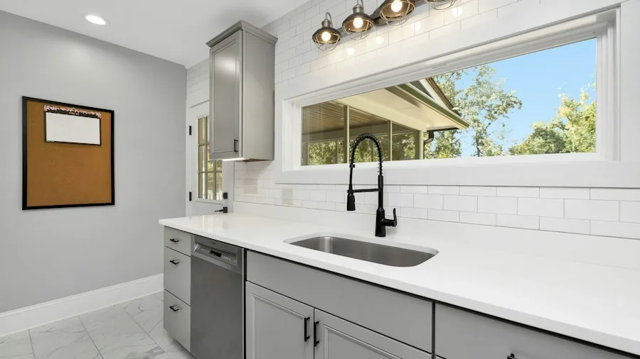 Kitchen Paint Makeover Transforms Dark Space into Bright Neutral Haven 3 white tile backsplash modern kitchen