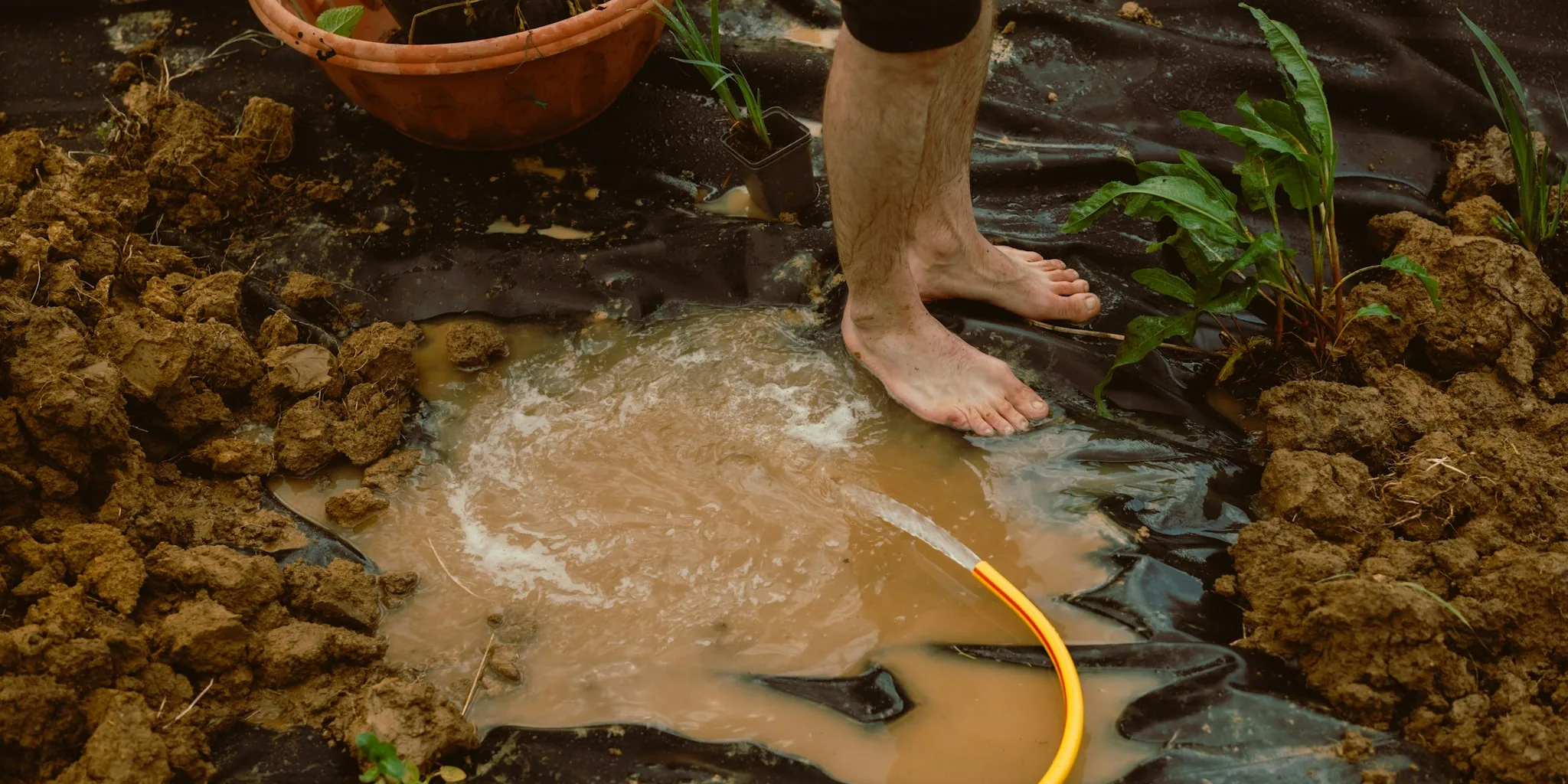Reuse Old Shower Curtains as Garden Weed Barriers